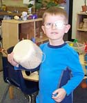 [WK makes his own drum during project/activity choice time.]